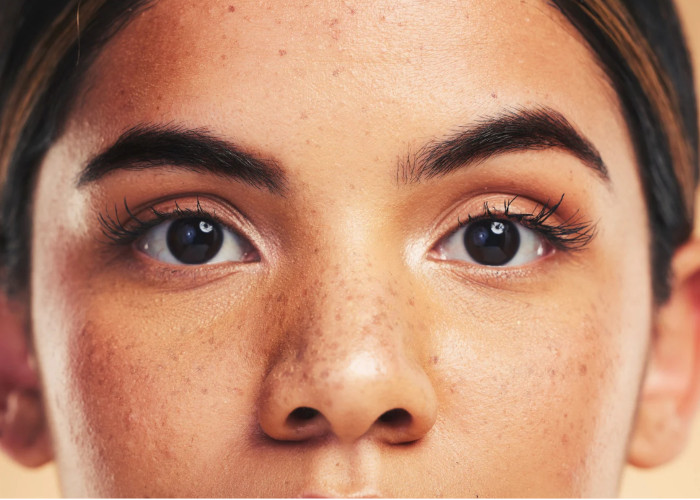 Head of young women staring straight at you